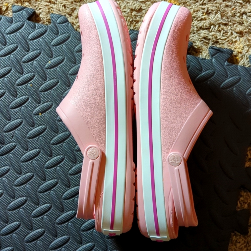 Pink Crocs size 12 in women and 10 in men